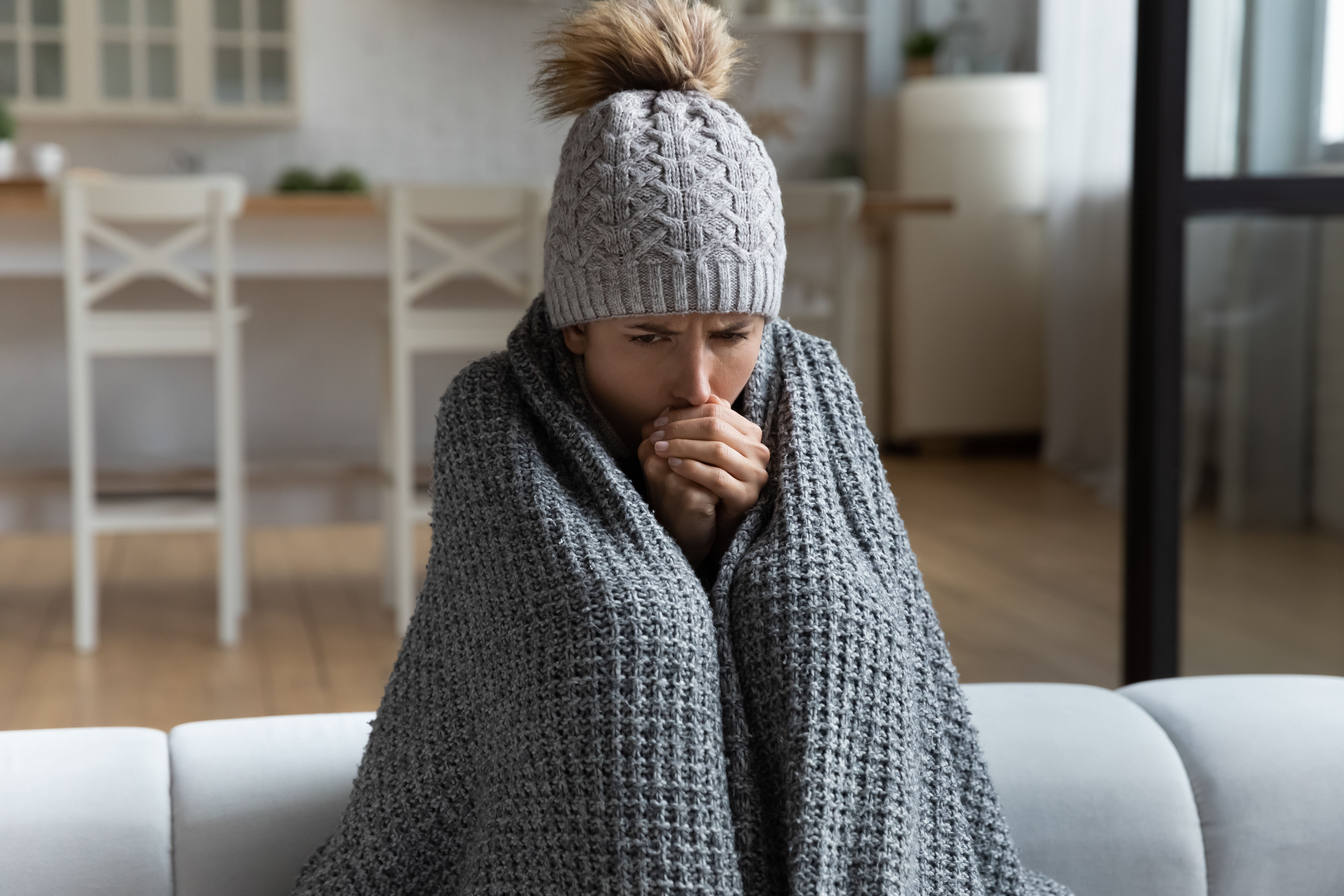 A homeowner wrapped in a blanket.